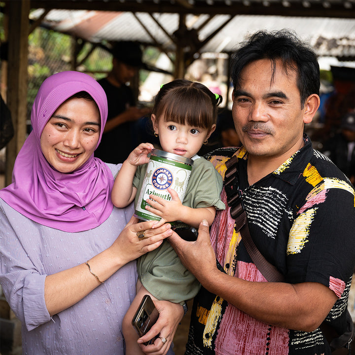 Family holding Compass Coffee Azimuth Blend in Bali
